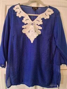 Cal Style tunic, striking white decorative embroidery along the neckline, sheer